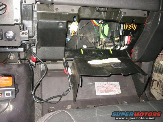 xm_install_09.jpg This was the second attempt at making it all fit.  Note the yellow zipties along the bottom edge of the glove box aperture: they're used to route the audio outputs and interface box cable.