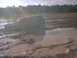 1978 Ford Bronco - An SUV is stuck deep in the mud, with only its side visible above the murky water.