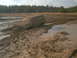 1978 Ford Bronco - This 1978 Ford Bronco is stuck in a mud pit with only the roof and windows visible above the mire.