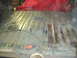 1996 Ford Bronco - The interior floor of a vehicle shows signs of rust and repair work, with electrical cords present.