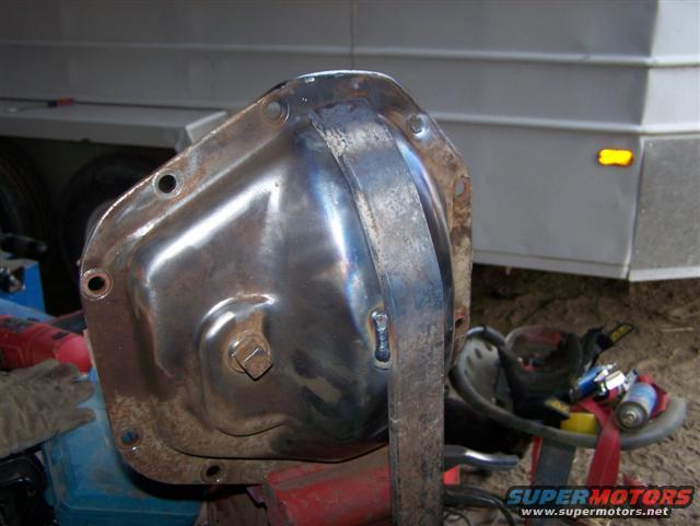 Differential cover with a welded bracket. Trailer in background