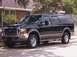 2000 Ford Excursion - This black Ford Excursion is shown from a 3/4 front angle.