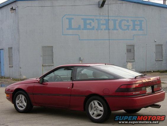 1991 Ford Probe, red, parked outside a building with 'LEHIGH' painted on the side. License plate is visible