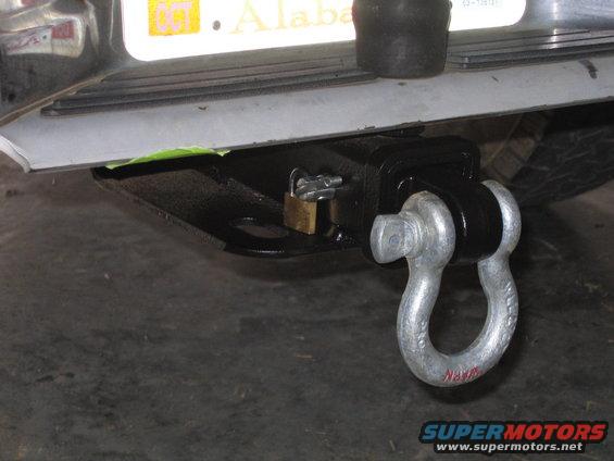 Trailer hitch with shackle and padlock, Alabama license plate visible