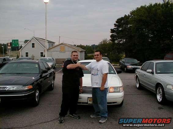 1997 Ford Crown Victoria front view with two men shaking hands