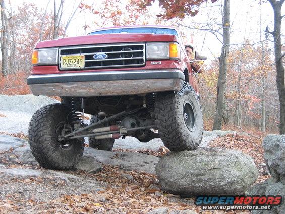 1990 Ford Bronco front grille and modified suspension on rocks
