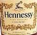 1997 Ford Crown Victoria - Label detail on a bottle of Hennessy VSOP Cognac, showing the brand name and decorative elements.