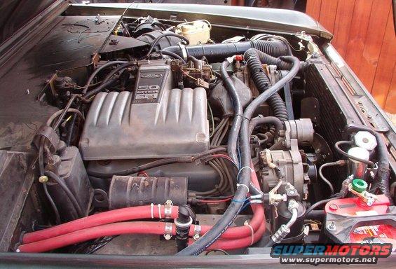 02engr.jpg Uuugh!  I'm either gonna replace those red hoses, or leather-dye them black.