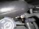 1997 Ford Crown Victoria - Close-up view of engine components, including the intake manifold, hoses, and an oil cap.