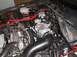 1997 Ford Crown Victoria - Close-up view of a modified engine bay, showing the throttle body and intake system.