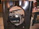 1978 Ford Bronco - Two black patch panels, likely for a vehicle's fender area, are displayed with various workshop items in the background.