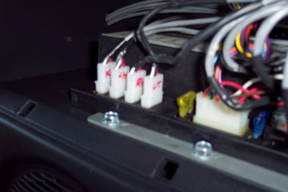 close-up of white wiring connectors labeled RH and LT, with fuses and bundle of wires
