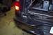 2002 Chevrolet Suburban - Wiring is being installed for an aftermarket light bar on the rear bumper of a vehicle.