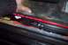 2002 Chevrolet Suburban - Wiring and power cable visible on the floor of a vehicle's interior.