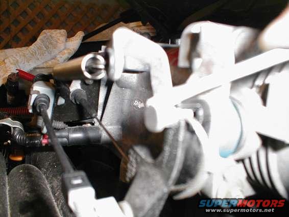 Close-up of engine intake manifold with hoses and electrical connectors attached