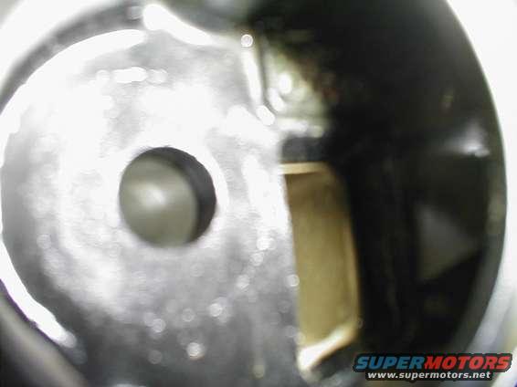 Engine intake manifold opening with Supermotors logo