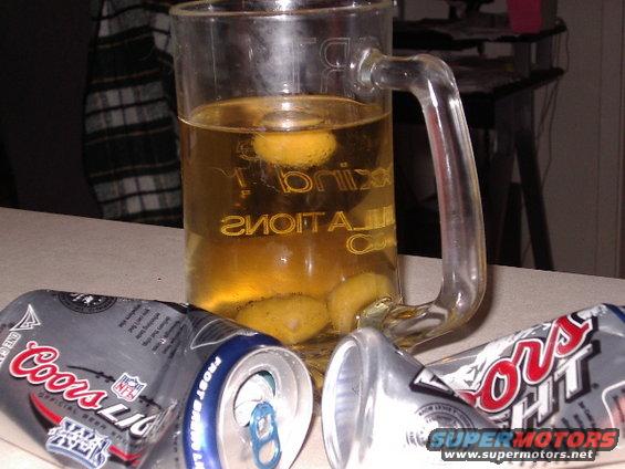 Beer mug with lemons and Coors Light cans
