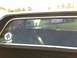 1979 Ford Ranchero - Rear window interior view with stickers, reflecting other vehicles outside.