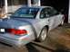 2003 Ford Crown Victoria - Rear view of a silver 2003 Ford Crown Victoria parked on a paved surface.