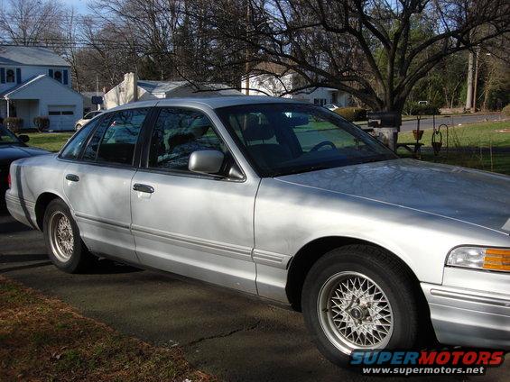 Silver 2003 Ford Crown Victoria parked in a driveway