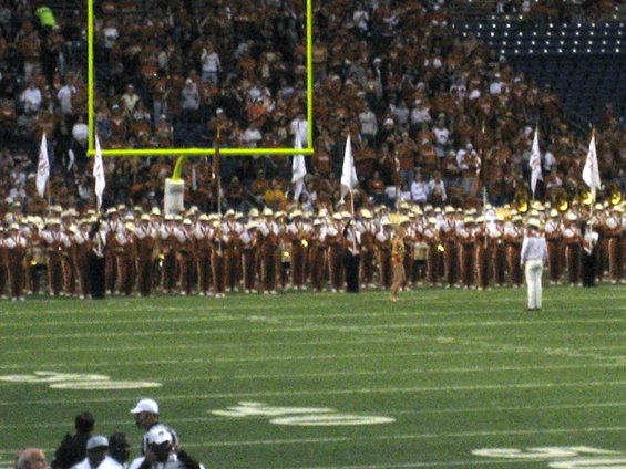 Marching band on football field with goal post