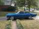 1968 Ford Torino - A blue 1969 Mercury Cougar XR-7 coupe with a black vinyl roof and custom wheels is parked outside a suburban driveway.