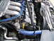 1997 Ford Probe - Close-up view of the engine compartment of a 1997 Ford Probe, highlighting the V6 engine components.