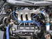 1997 Ford Probe - Close-up of a Ford V6 engine, showing the intake manifold and spark plug wires.