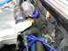 1997 Ford Probe - A detailed view of various hoses and mechanical parts within a vehicle's engine bay.