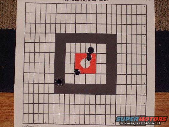 100 yards sighting target with bullet holes