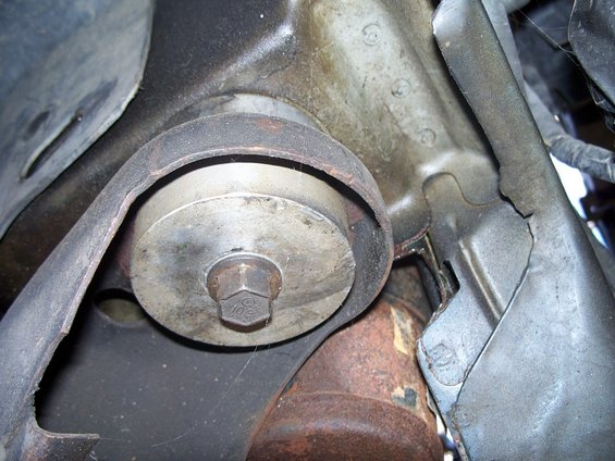 Close-up of a bolt securing a metal engine mount bracket