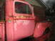 1952 Ford Pickup - This 1952 Ford Pickup truck, seen from a 3/4 front angle, displays significant rust and wear, indicating its age and history.