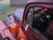 1952 Ford Pickup - Interior view of a 1952 Ford Pickup, with a tarp covering part of the hood and interior.