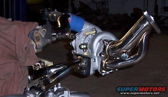 turbo2.jpg a stockish aftermarket downpipe going the wrong way for this application.