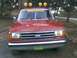 1989 Ford Bronco - This red Ford pickup truck has a grille that indicates it is from the late 1980s.