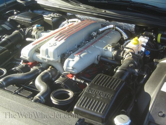 Ferrari engine with twin intake manifolds and "FERRARI" stamped on air cleaner