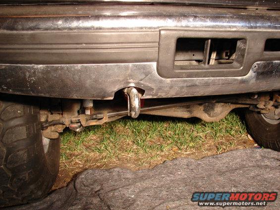 1996 Ford Bronco rear bumper with tow hook and suspension visible