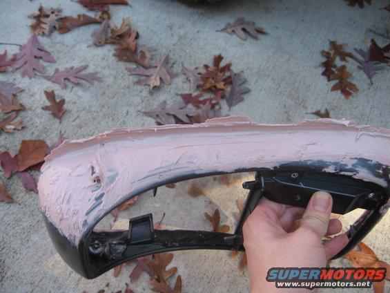 img_0567.jpg When I first posted pictures, I noticed the large divits in my bondo.  Here i am filling in the voids and perfecting the edge that meets the foor.