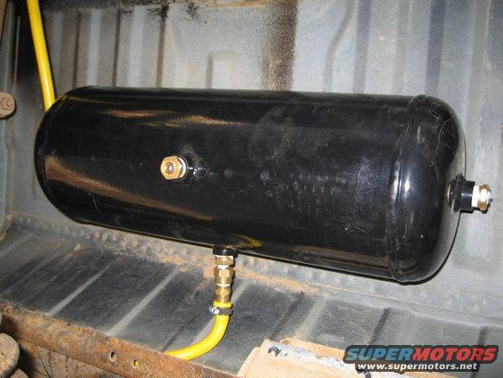 Here is the tank.  The hose on the goes out the back and the hose in the middle is coming from the engine compartment.  