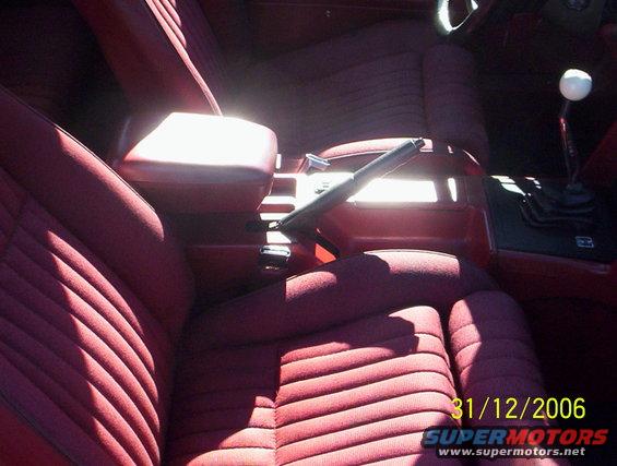 Red fabric seats and center console with automatic shifter and parking brake