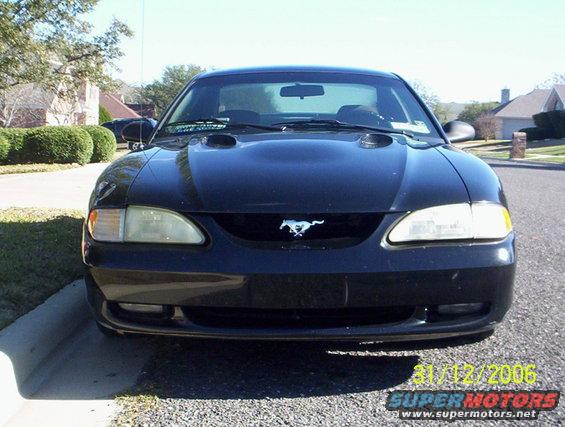 Black 1995 Ford Mustang front view, showing grille with running horse emblem
