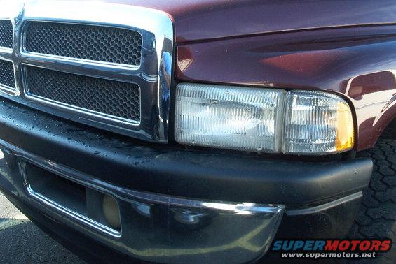Maroon truck front grille and headlight. 2001 Dodge 1500