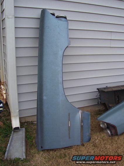 Blue fender with chrome trim and a taillight assembly with dual lights