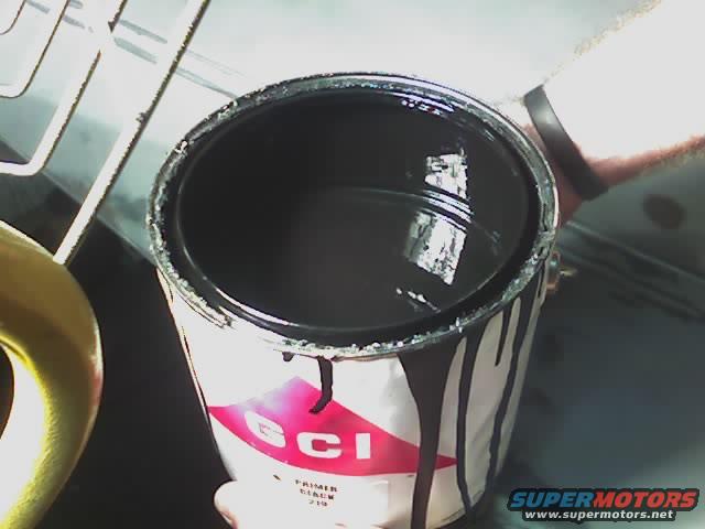 123006_1908.jpg This is how much primer I've used. I lack the two doors and the filler under the grille! ! ! Believe me I put as much on there as I could in one go.