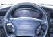 1997 Ford Thunderbird - The instrument cluster and steering wheel of a 1997 Ford Thunderbird LX are visible.
