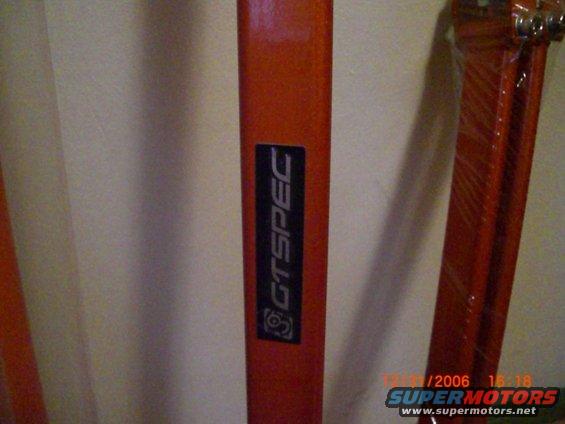 Orange metal bars with a black sticker that says GTSPEC
