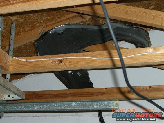 car fender stored in attic rafters