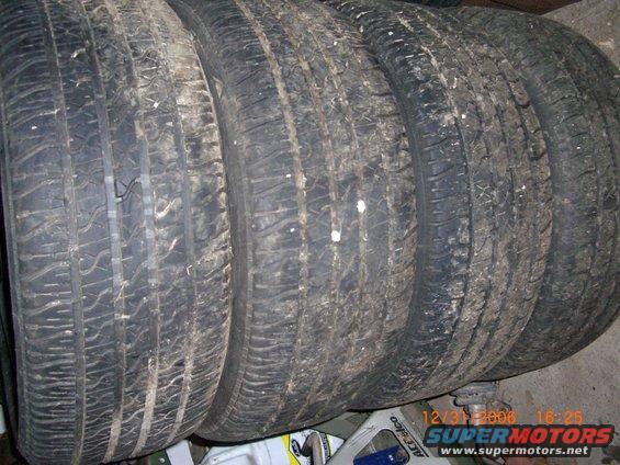 Four used tires stacked