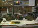 1986 Ford Bronco - Workbench cluttered with automotive differential parts and tools.