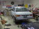 1981 BMW 3 Series - A 1981 BMW 3 Series sedan is parked in a cluttered garage, viewed from the rear.